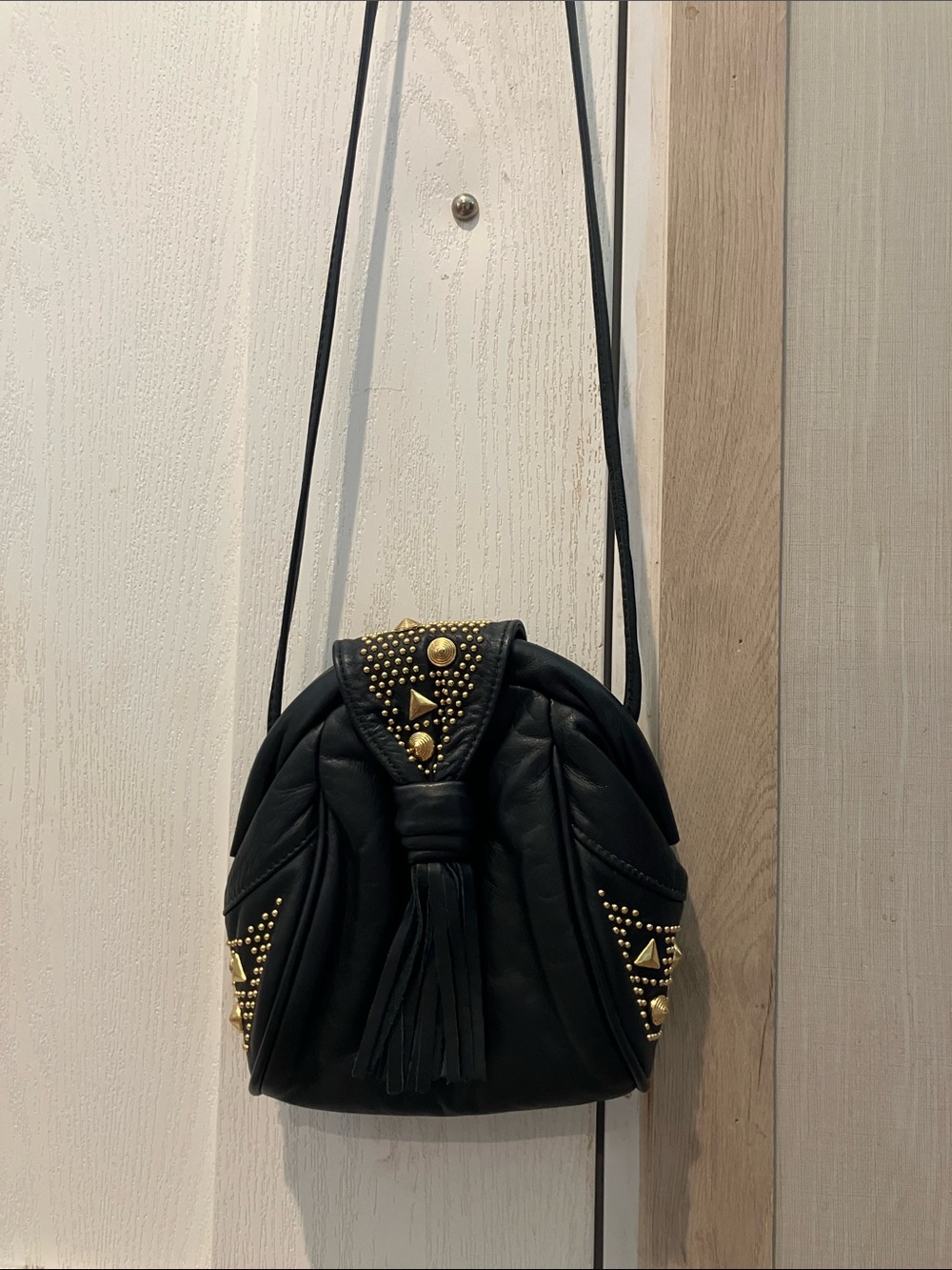 Black Studded Tassel Crossbody Bag with Gold Accents